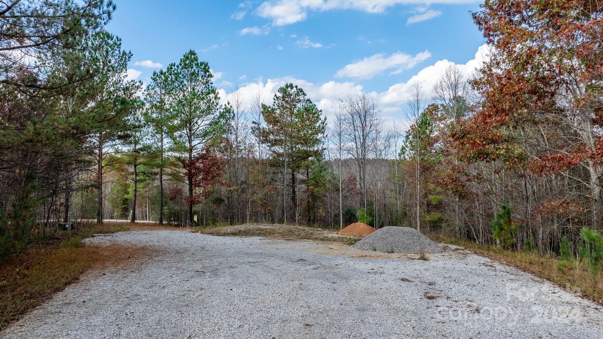 a view of a road with a trees in the background