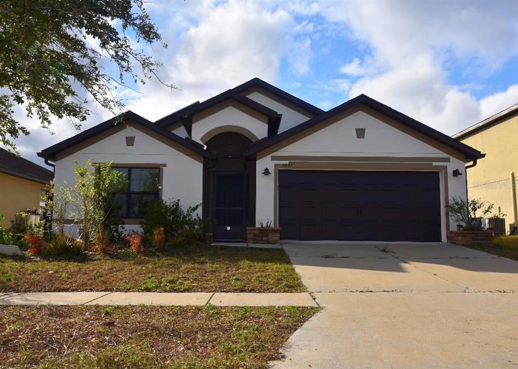 front view of a house with a yard