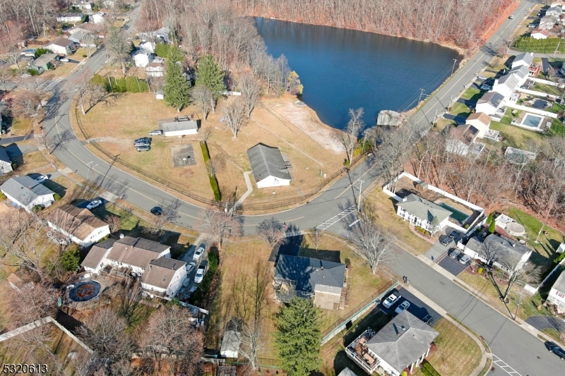 an aerial view of a residential houses with outdoor space