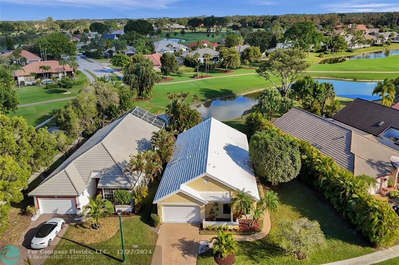 an aerial view of a house with outdoor space