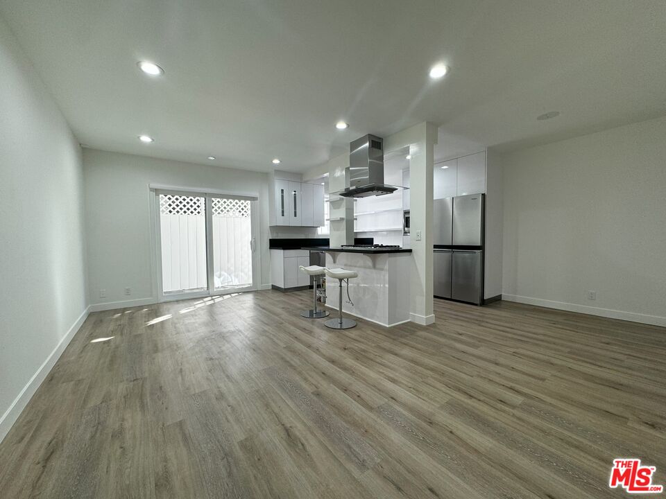 a view of kitchen with wooden floor