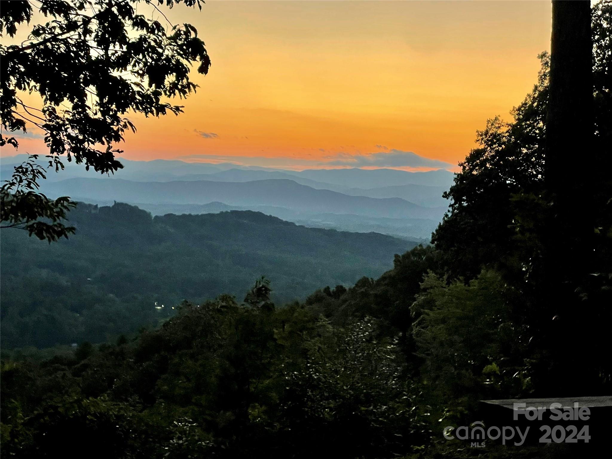 a view of mountain with sunset view