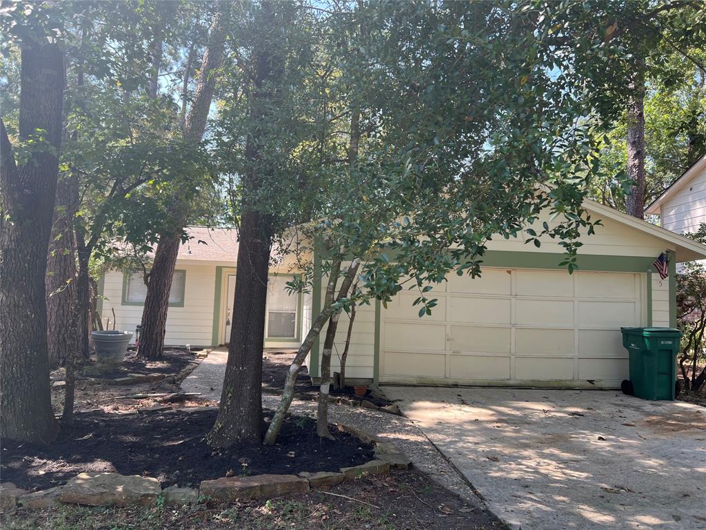 a view of a house with a tree