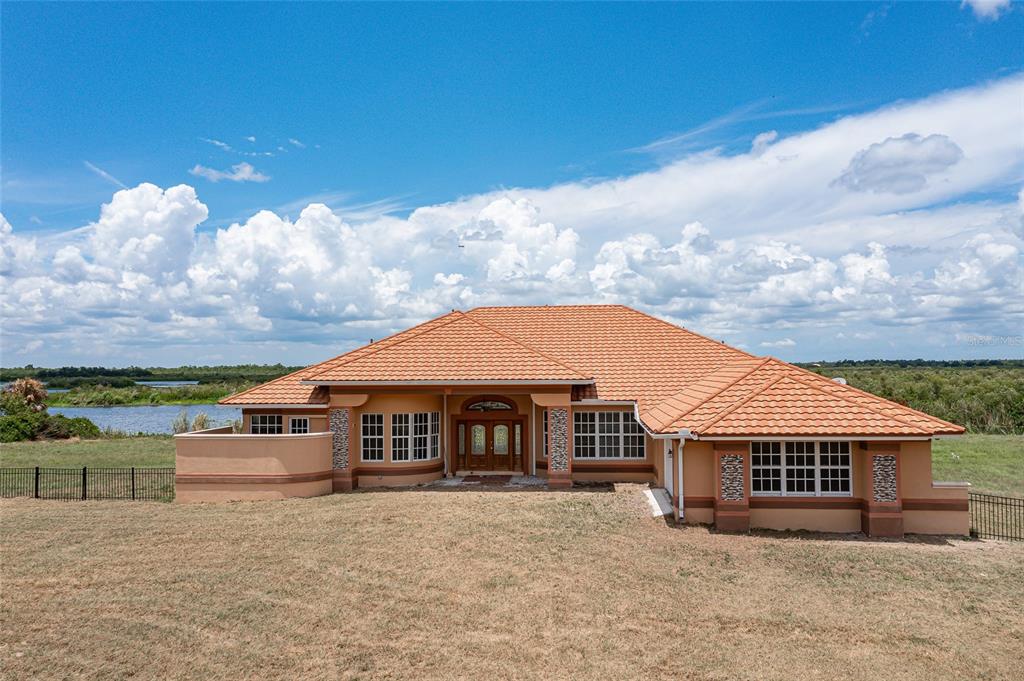 a front view of house with yard and entertaining space