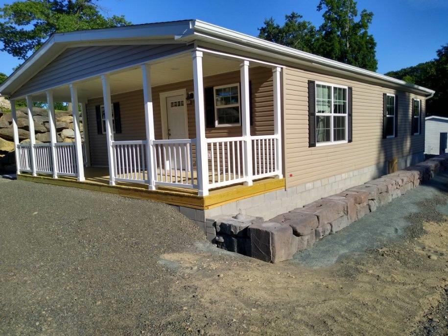 View of property exterior with a porch