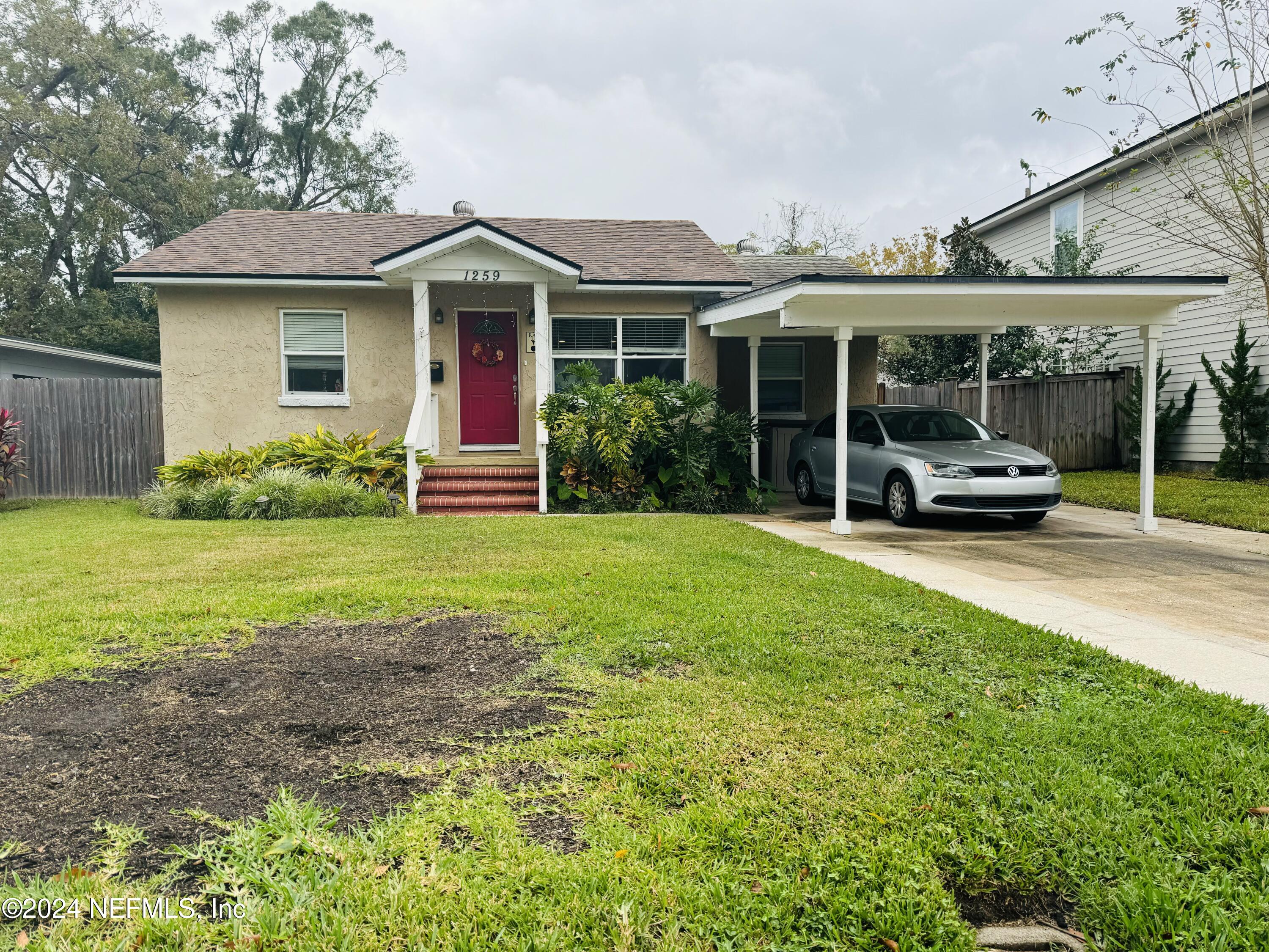 a front view of a house with garden