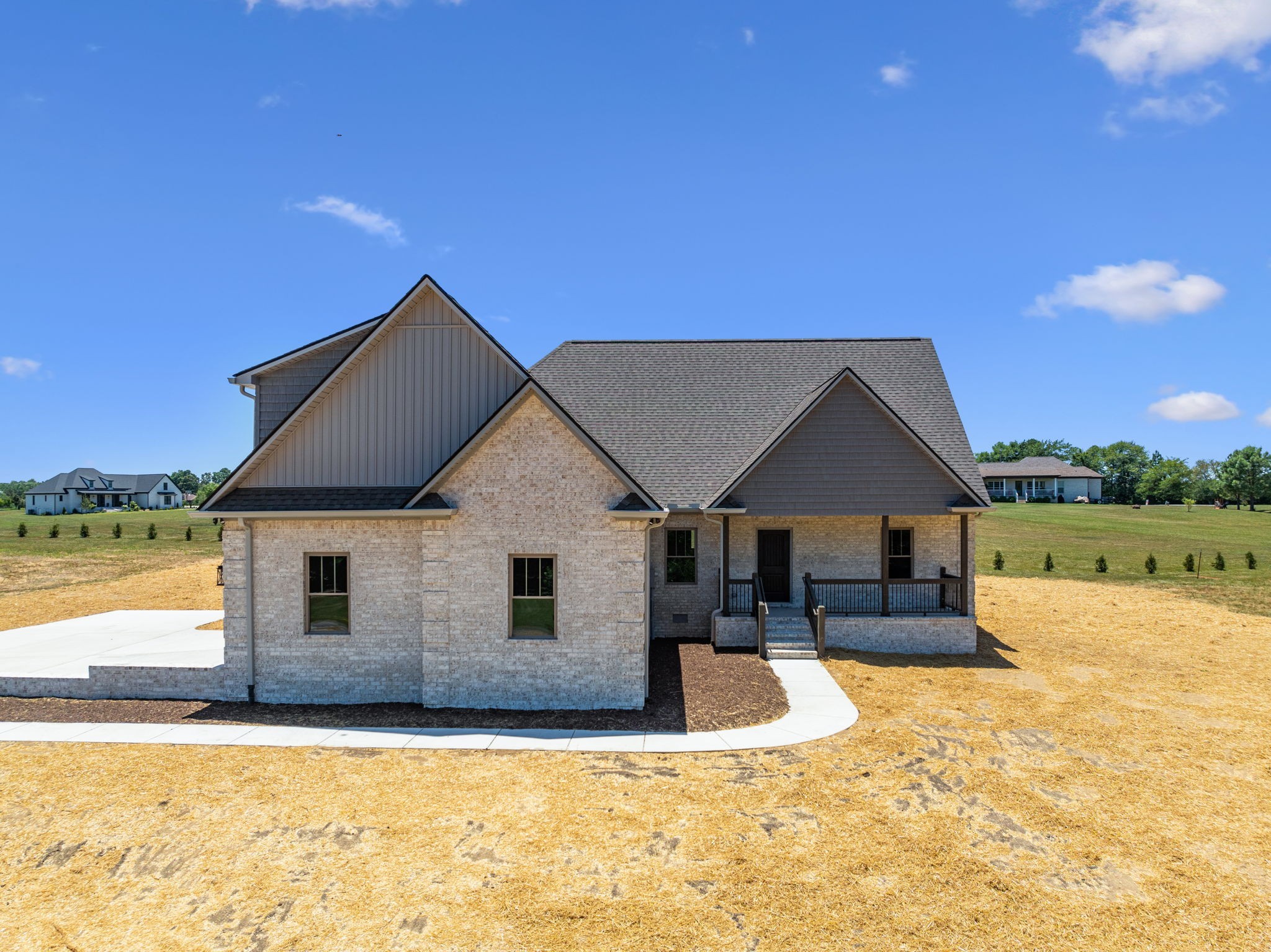 a view of a house with pool and a yard