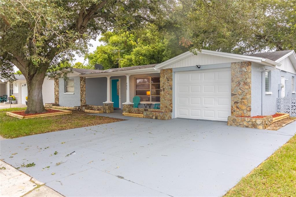 a backyard of a house with yard and garage