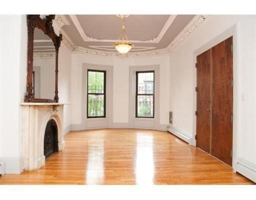 a view of livingroom with fireplace and window