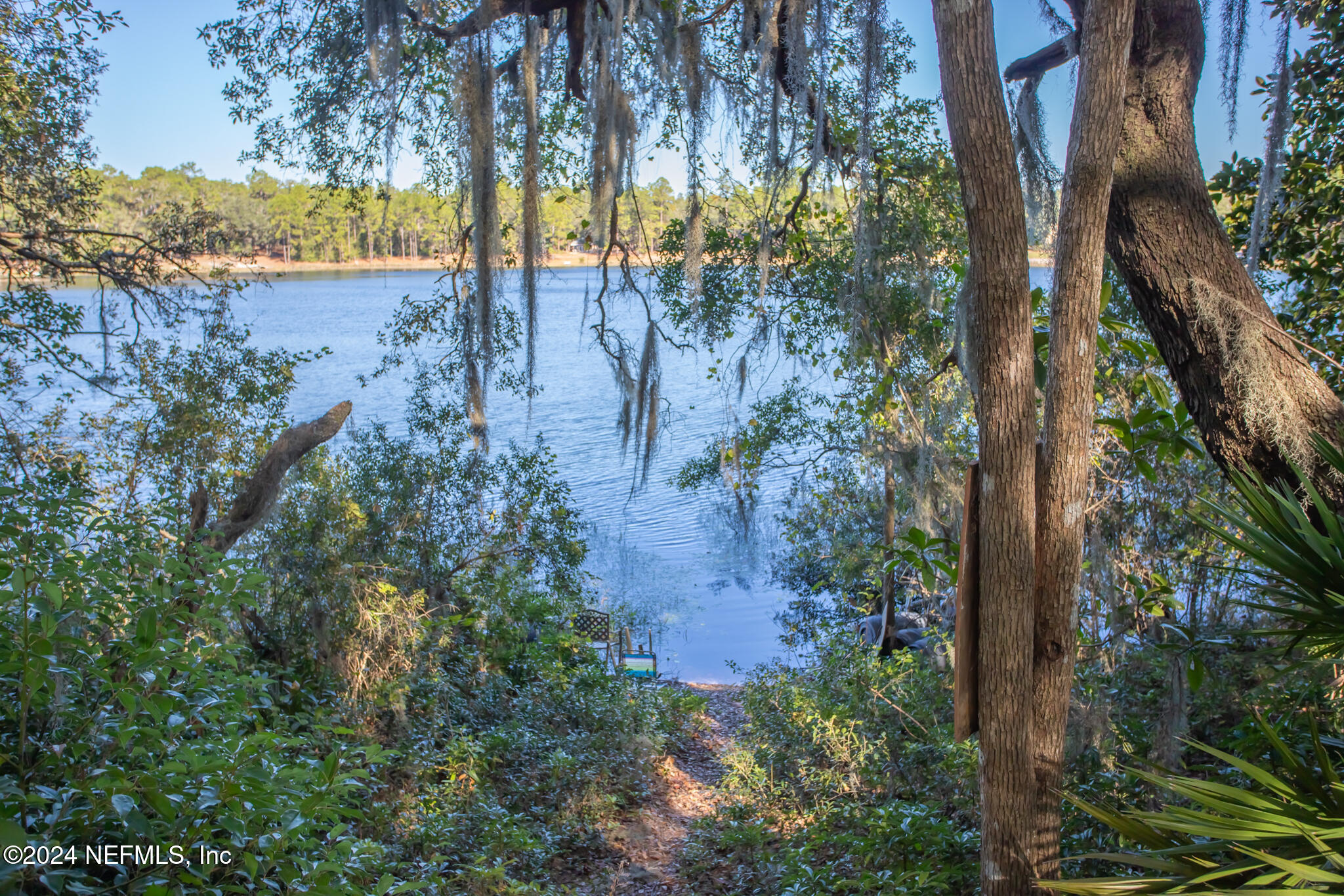 a view of lake with a yard