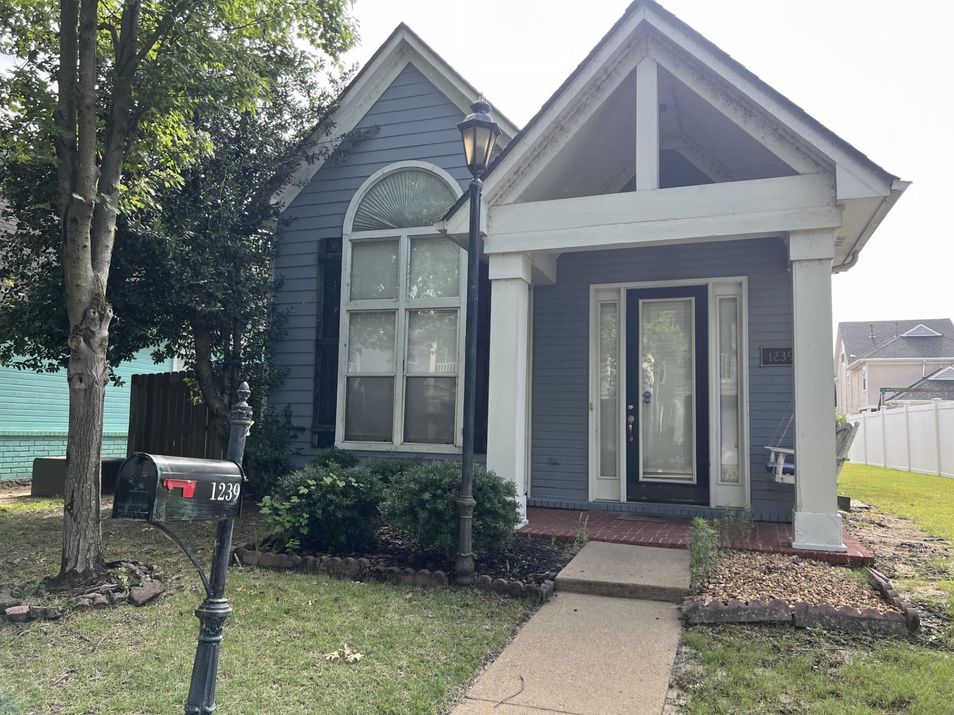 View of front of house featuring a front lawn