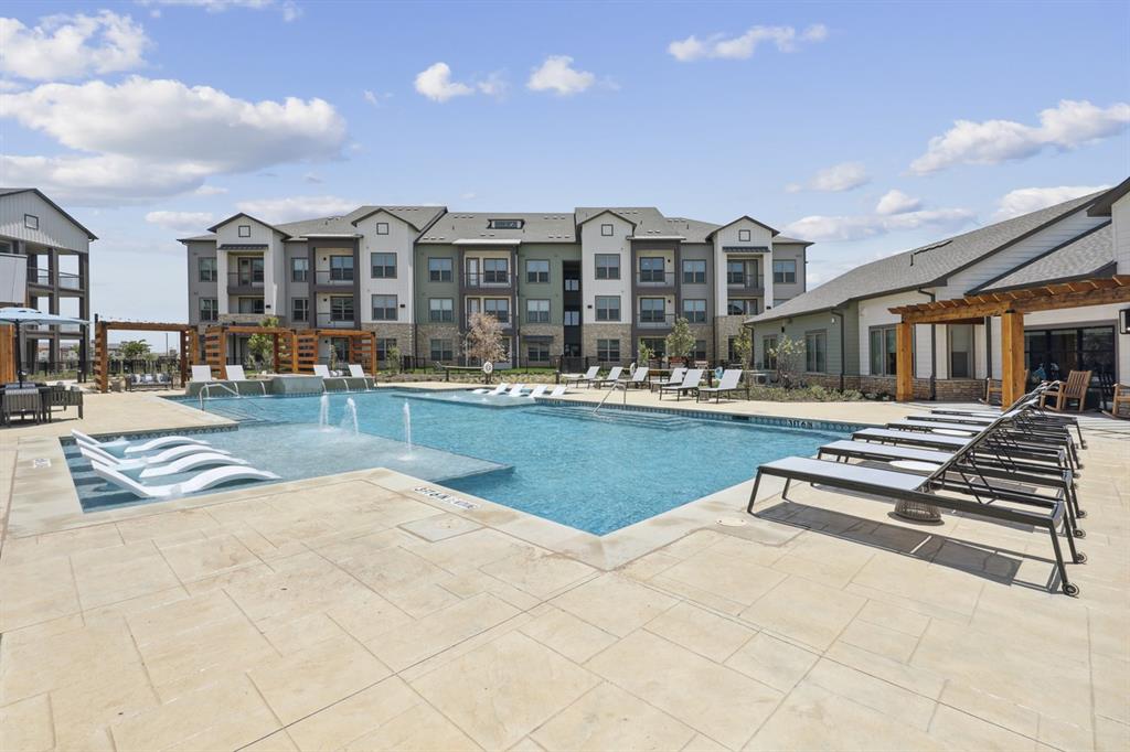 a view of swimming pool and outdoor seating