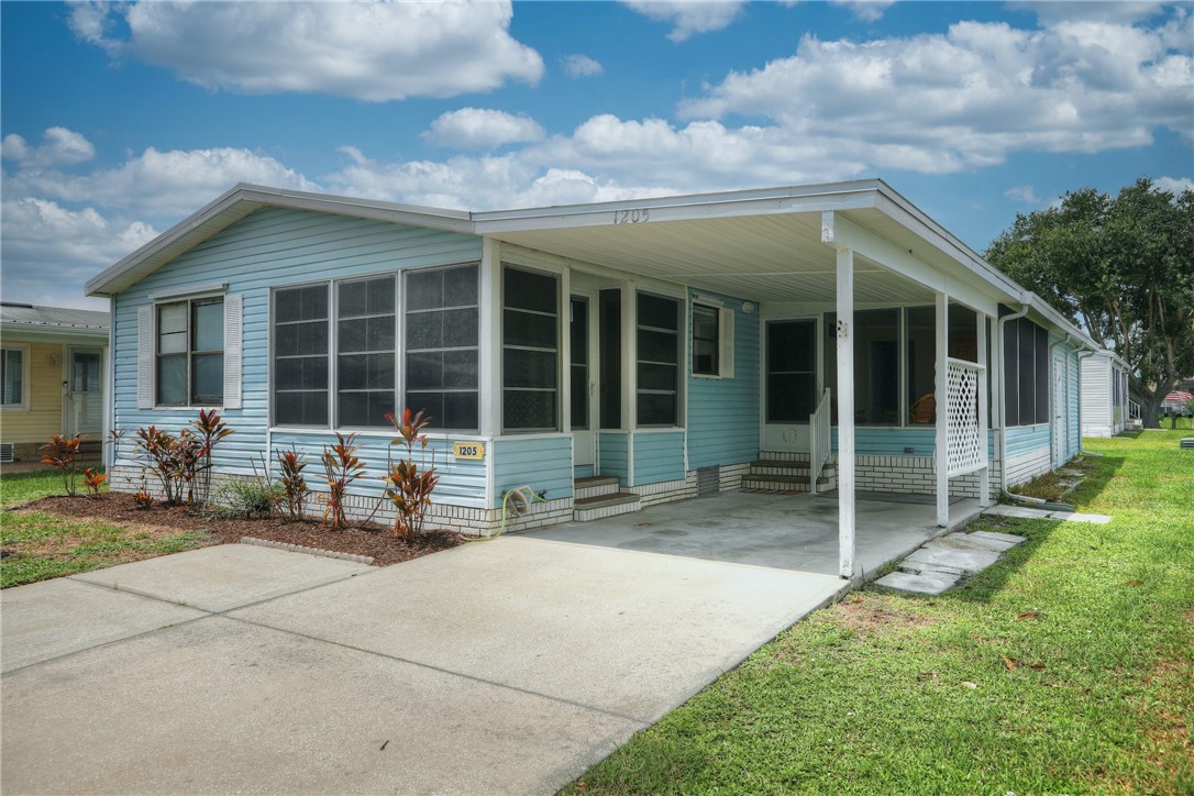 a row of table and chairs in front of a house