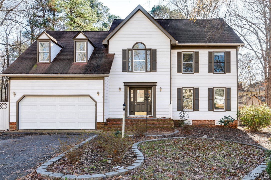 View of front of home featuring a garage