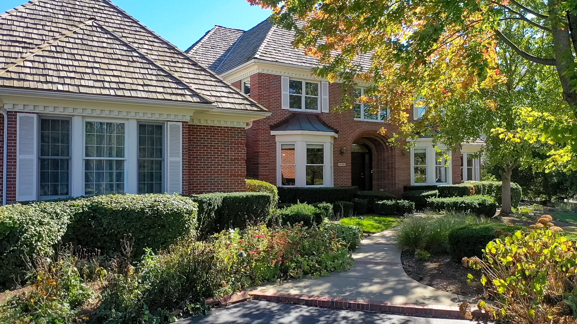 a front view of a house with a yard