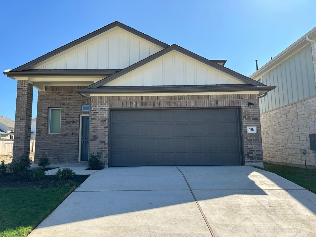 a front view of a house with a garage