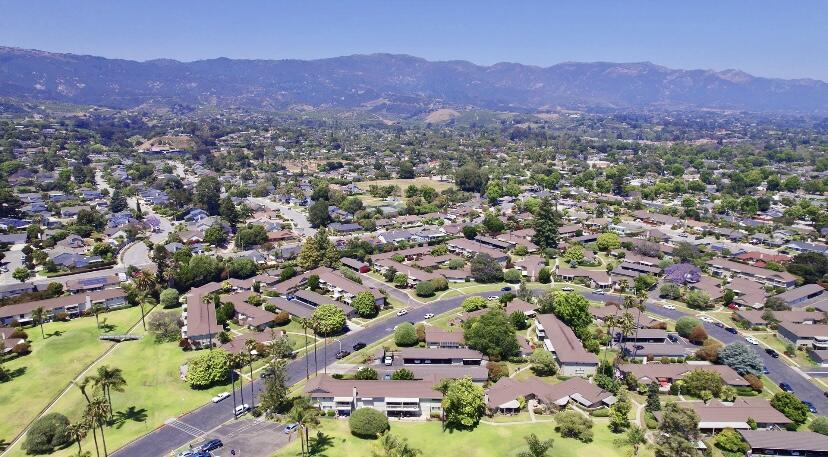 an aerial view of residential house with outdoor space and mountain view