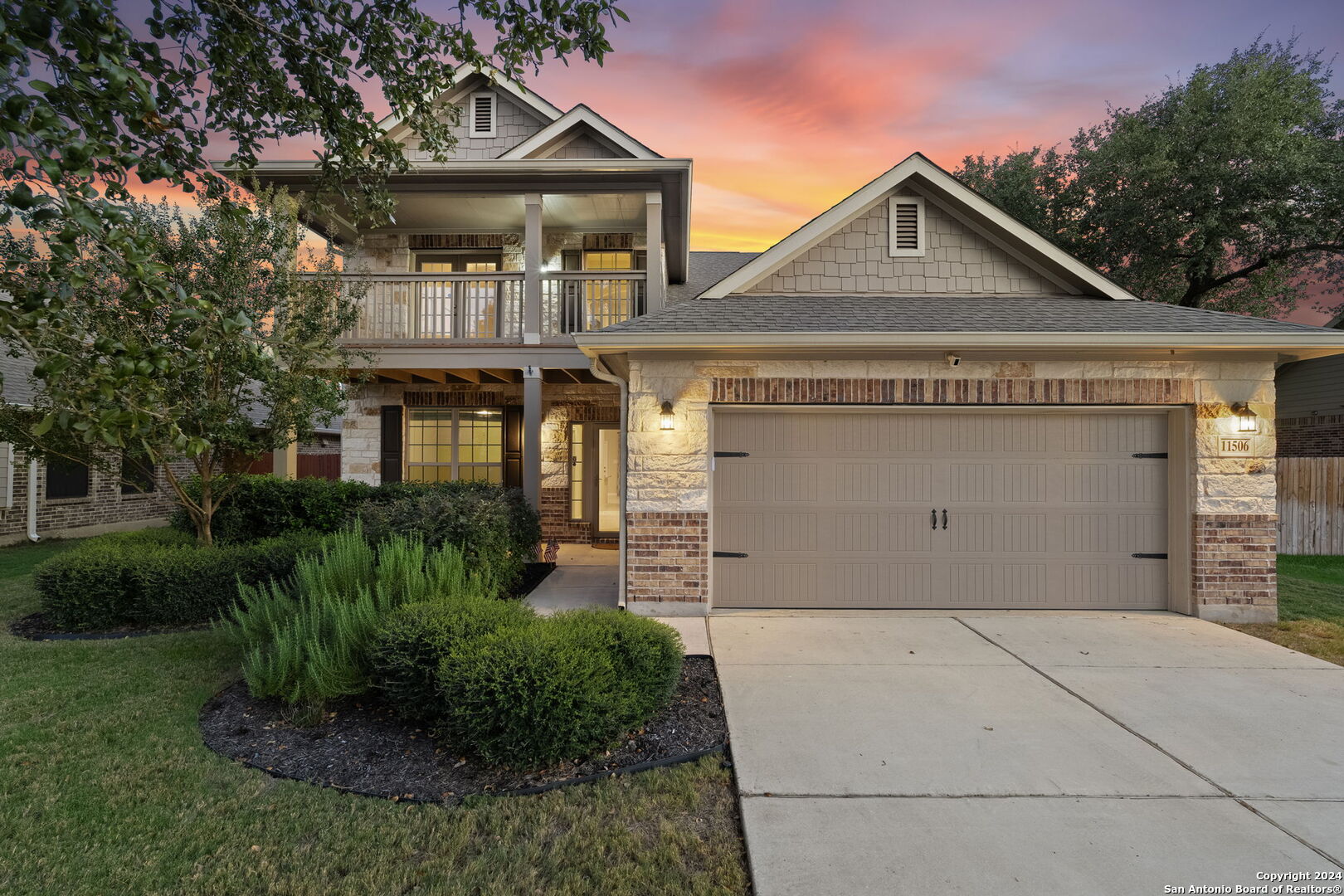 a front view of a house with a garage