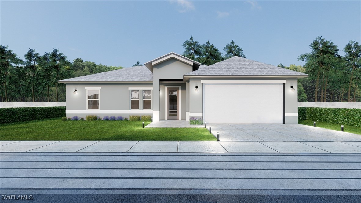 a front view of a house with a yard and garage