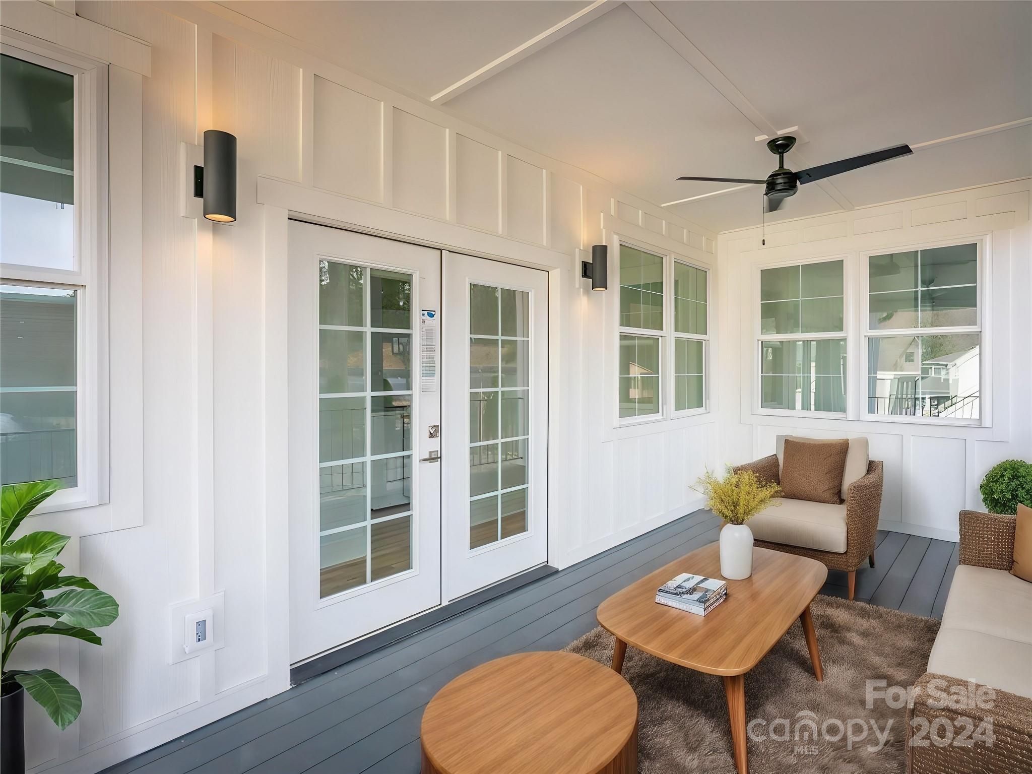 a living room with furniture and a window