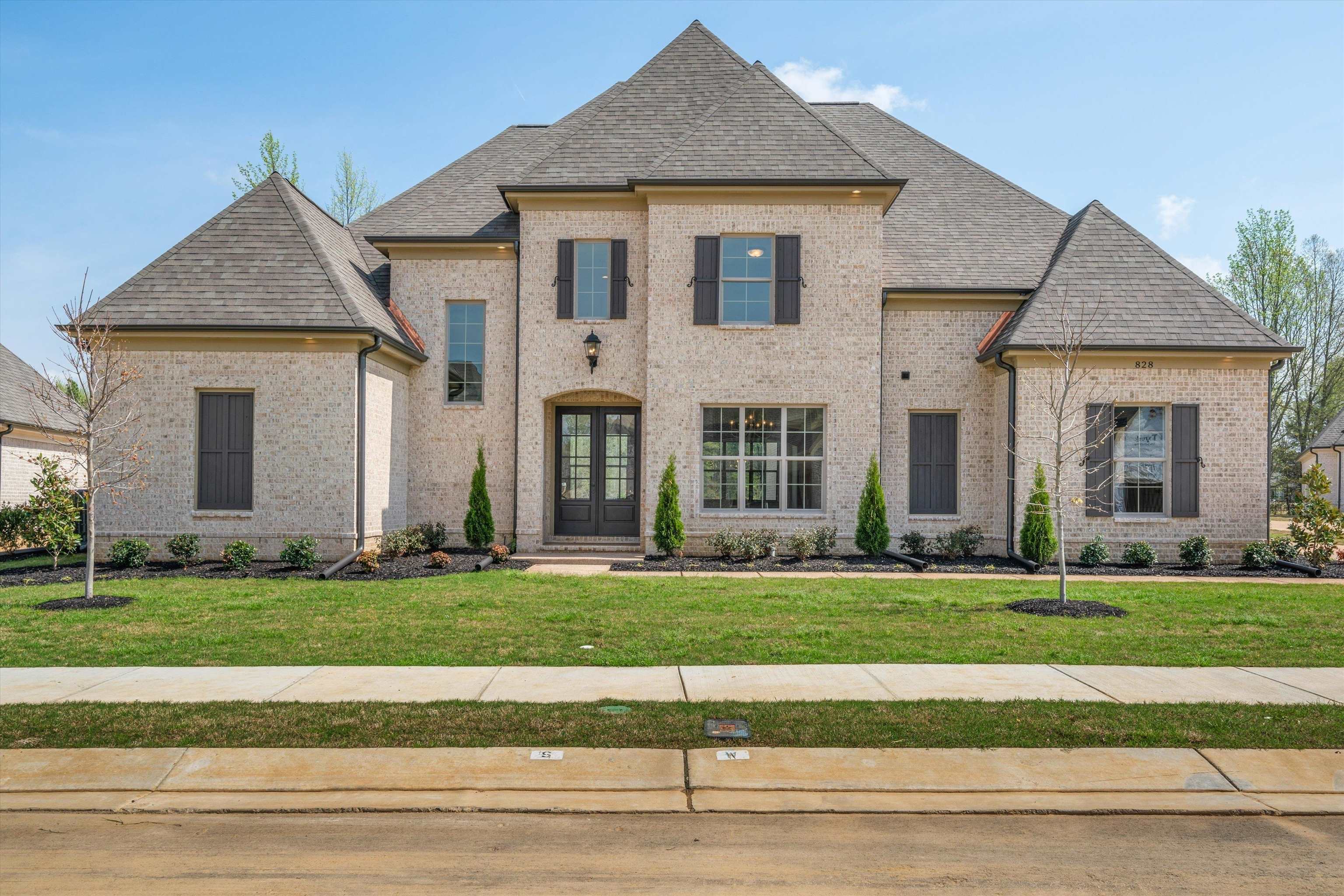 French country home with a front yard