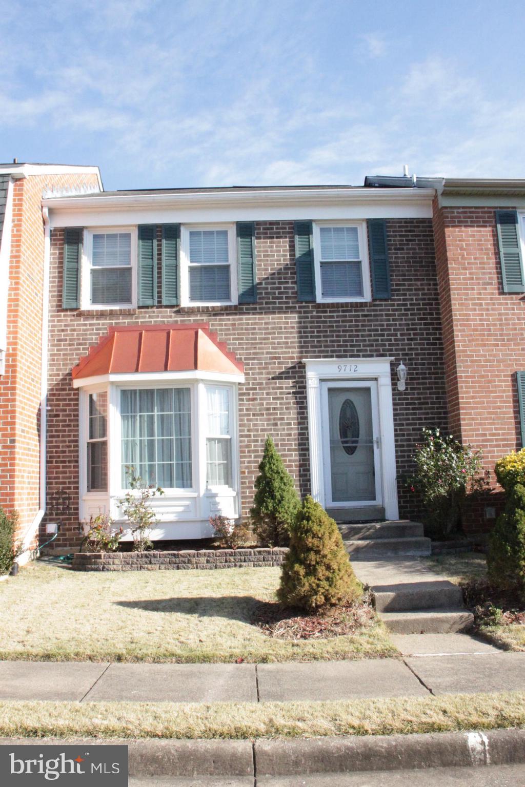 a front view of a house with street