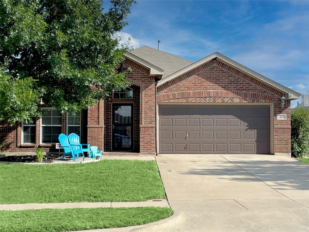 a front view of house with yard outdoor seating and green space