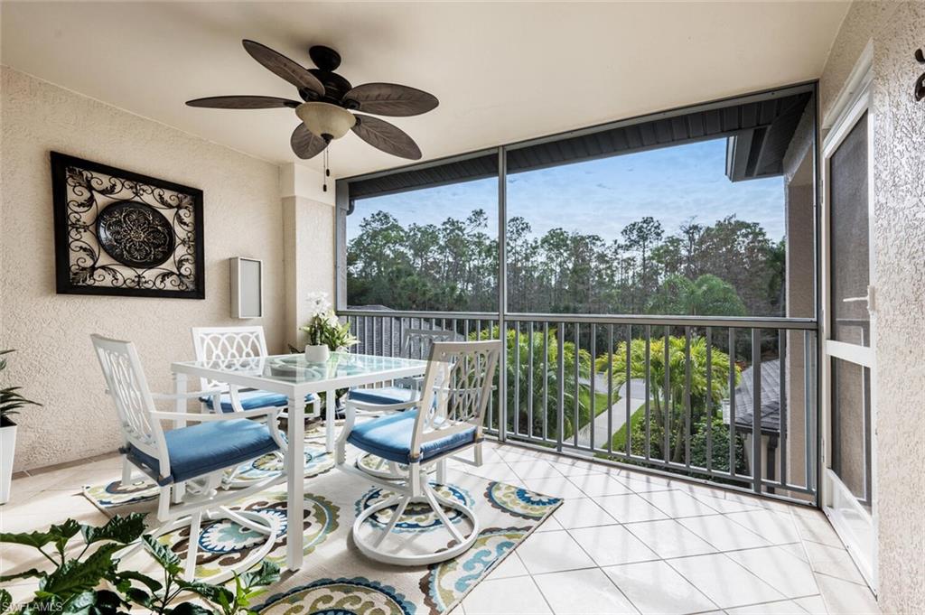 Sunroom featuring plenty of natural light and ceiling fan