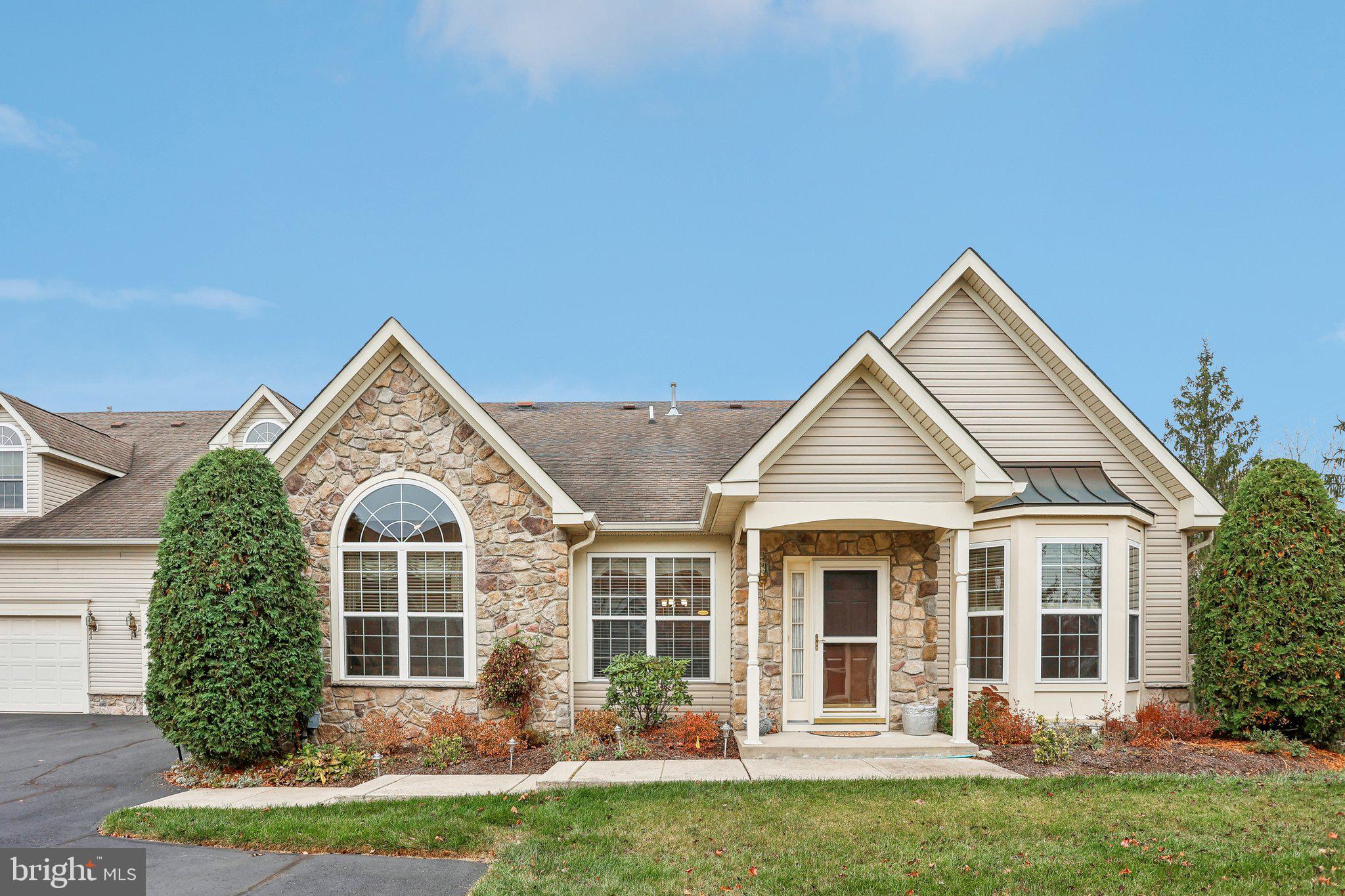 front view of a house with a yard