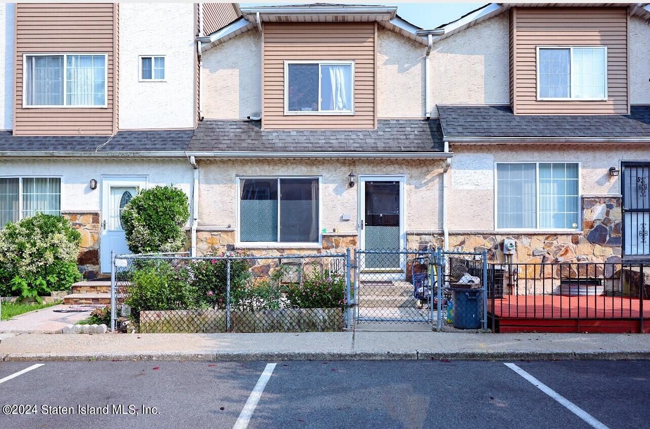 a front view of a house with yard