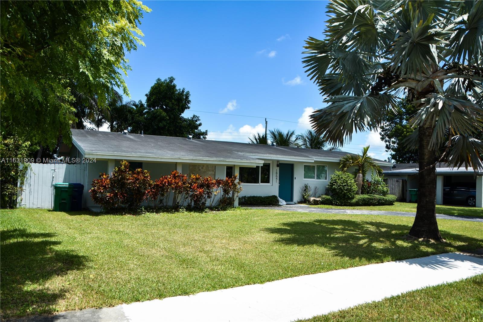 a view of a yard in front of a house