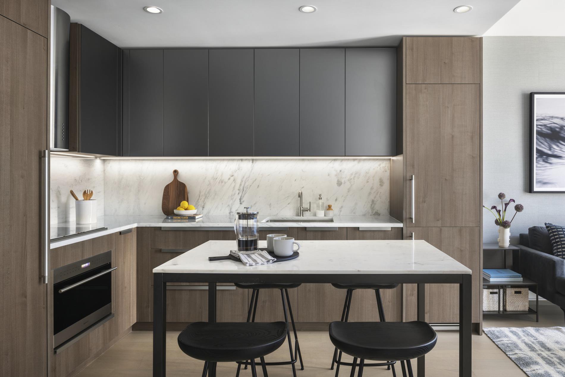 a kitchen with a dining table and chairs