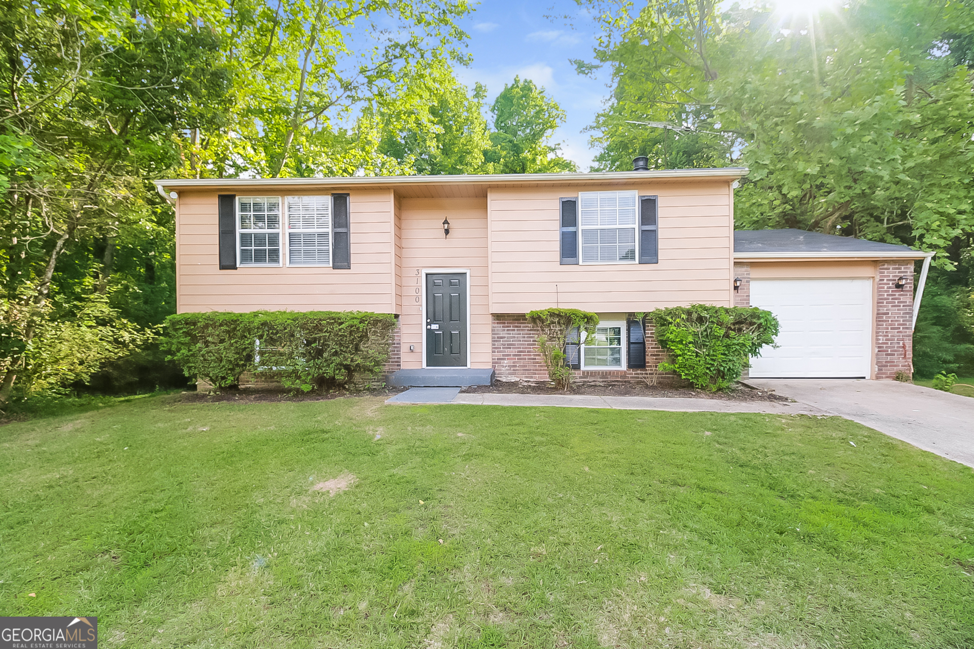 front view of a house with a yard