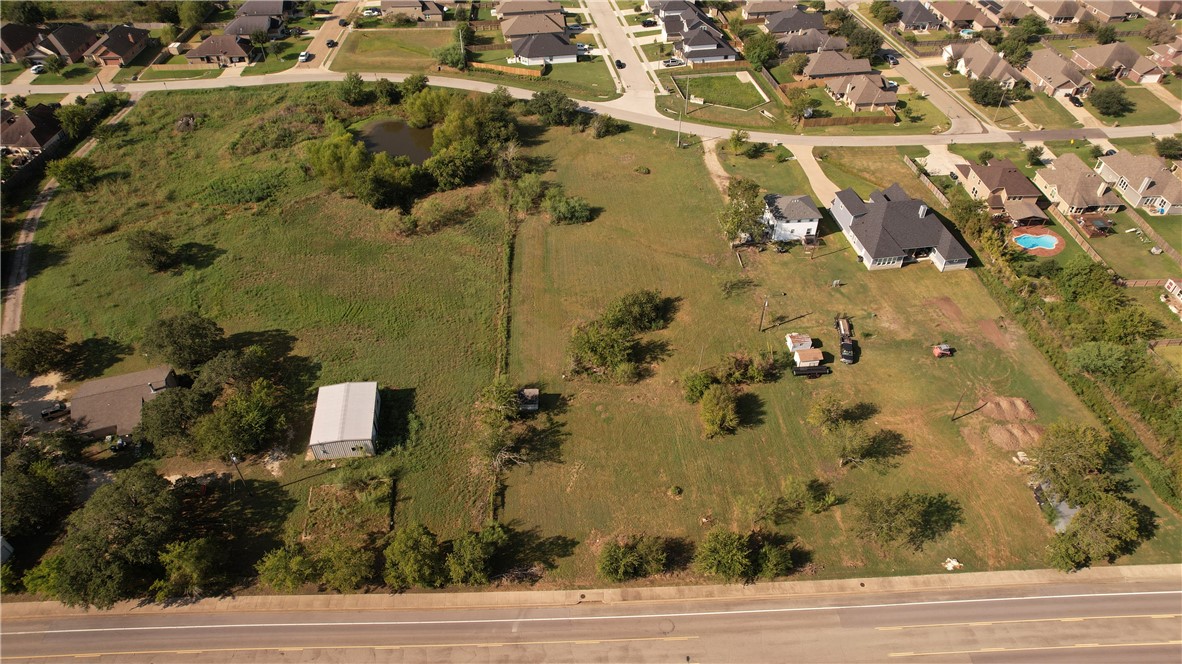 an aerial view of house with yard