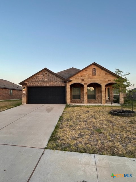 a front view of a house with garage