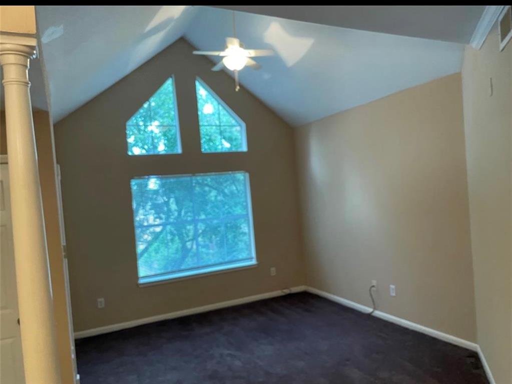 an empty room with windows and mountain view