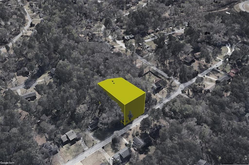 a aerial view of a house with a yard and a swimming pool