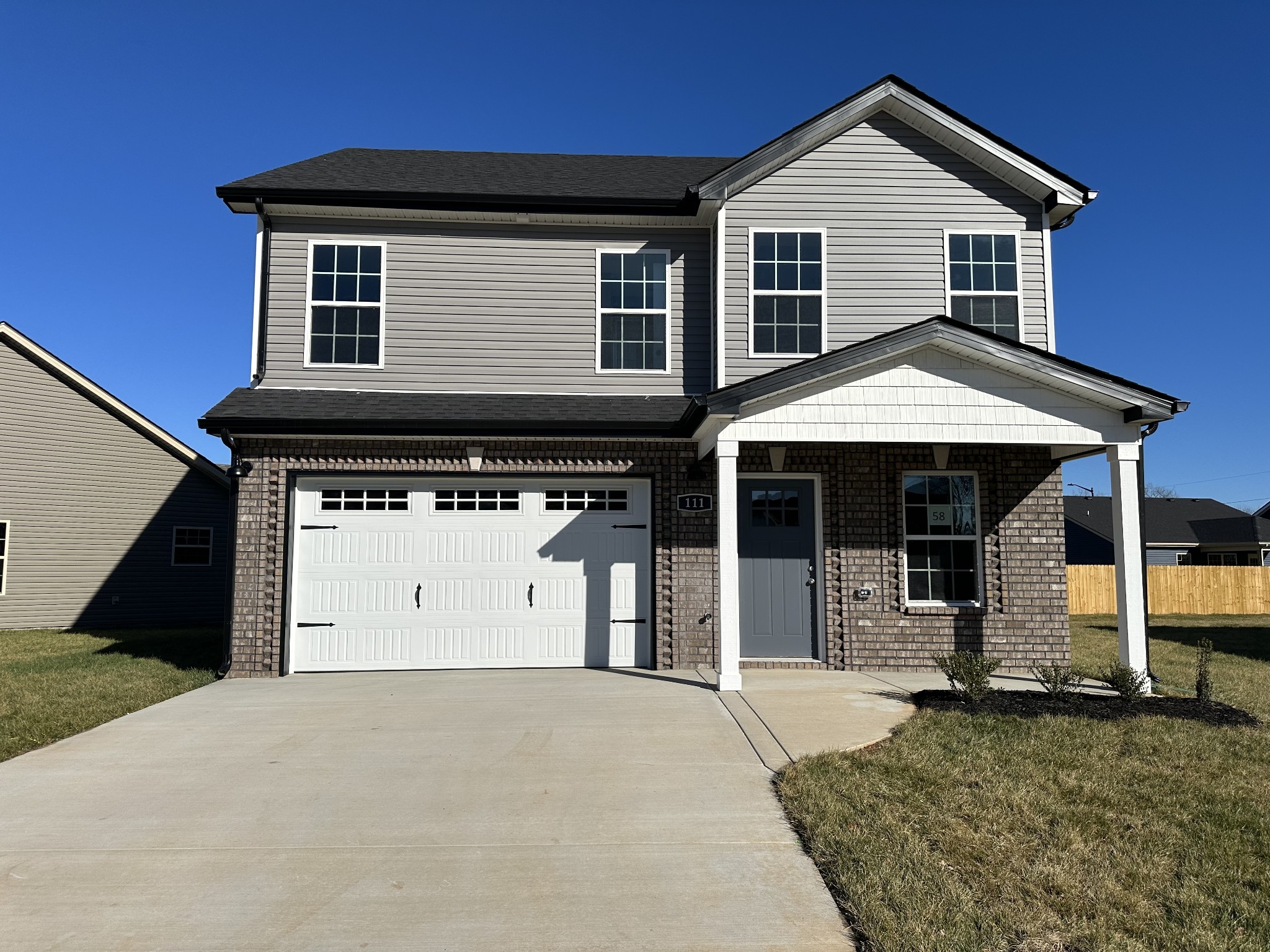 a front view of a house with garage