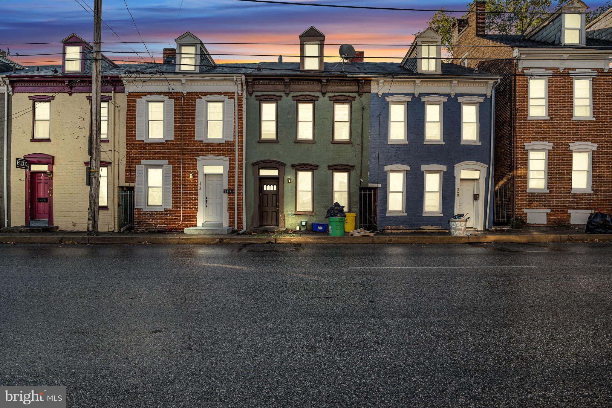 a front view of a building with street view