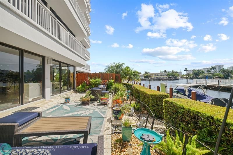 a view of a swimming pool with outdoor seating