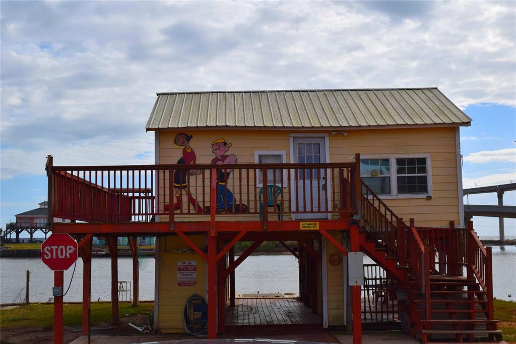 a view of a house with wooden deck