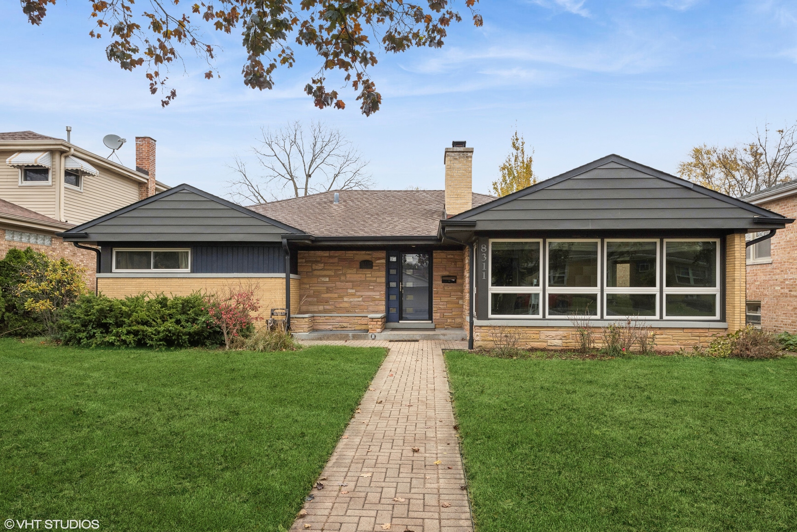 a front view of a house with a yard