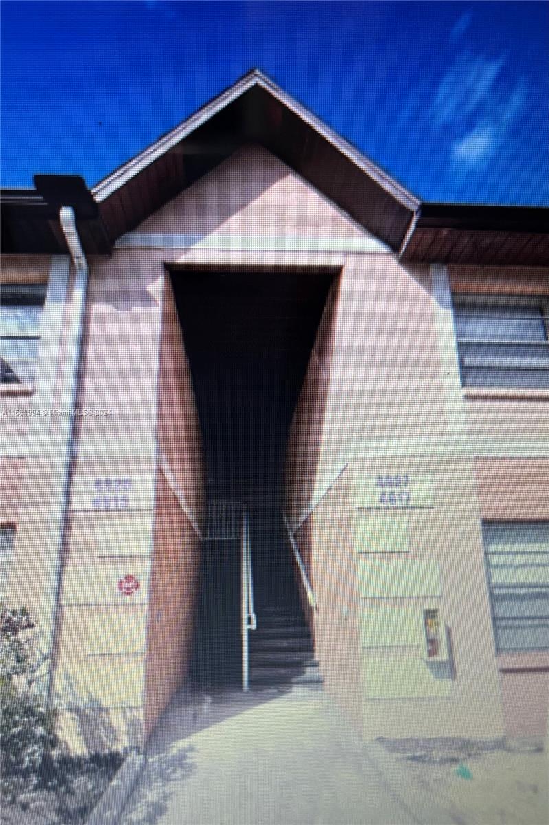 a front view of a house with stairs