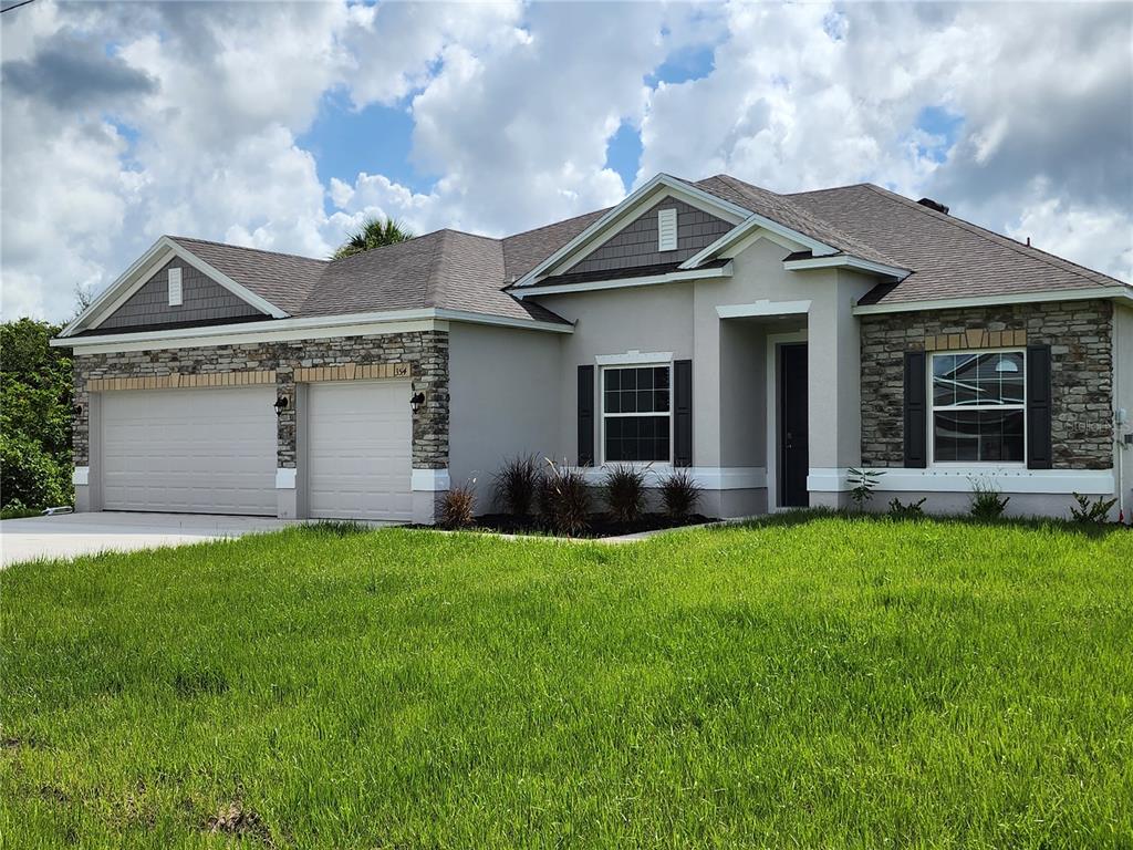 a view of a house with a yard