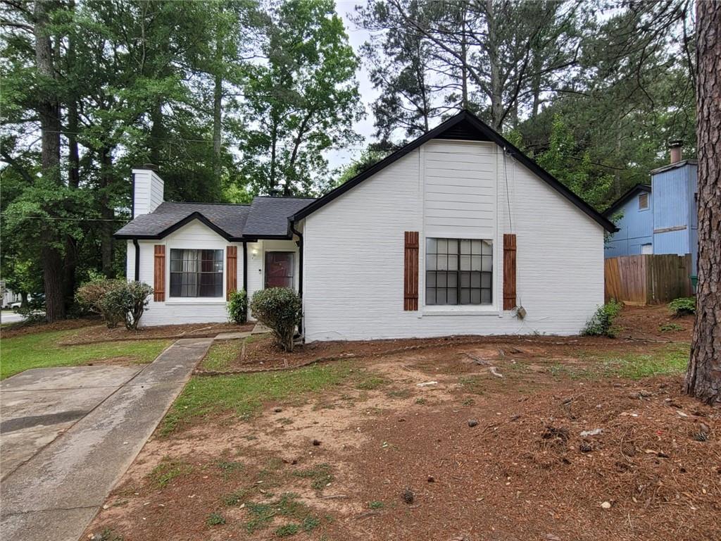 a house with trees in the background