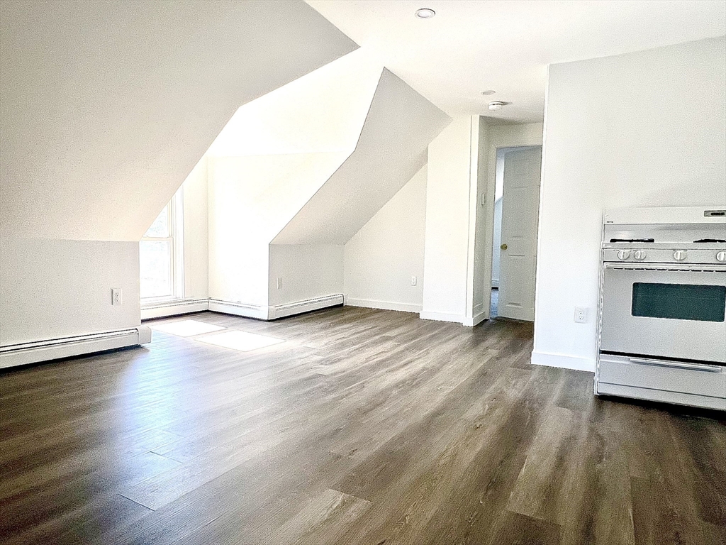 a view of a livingroom with wooden floor