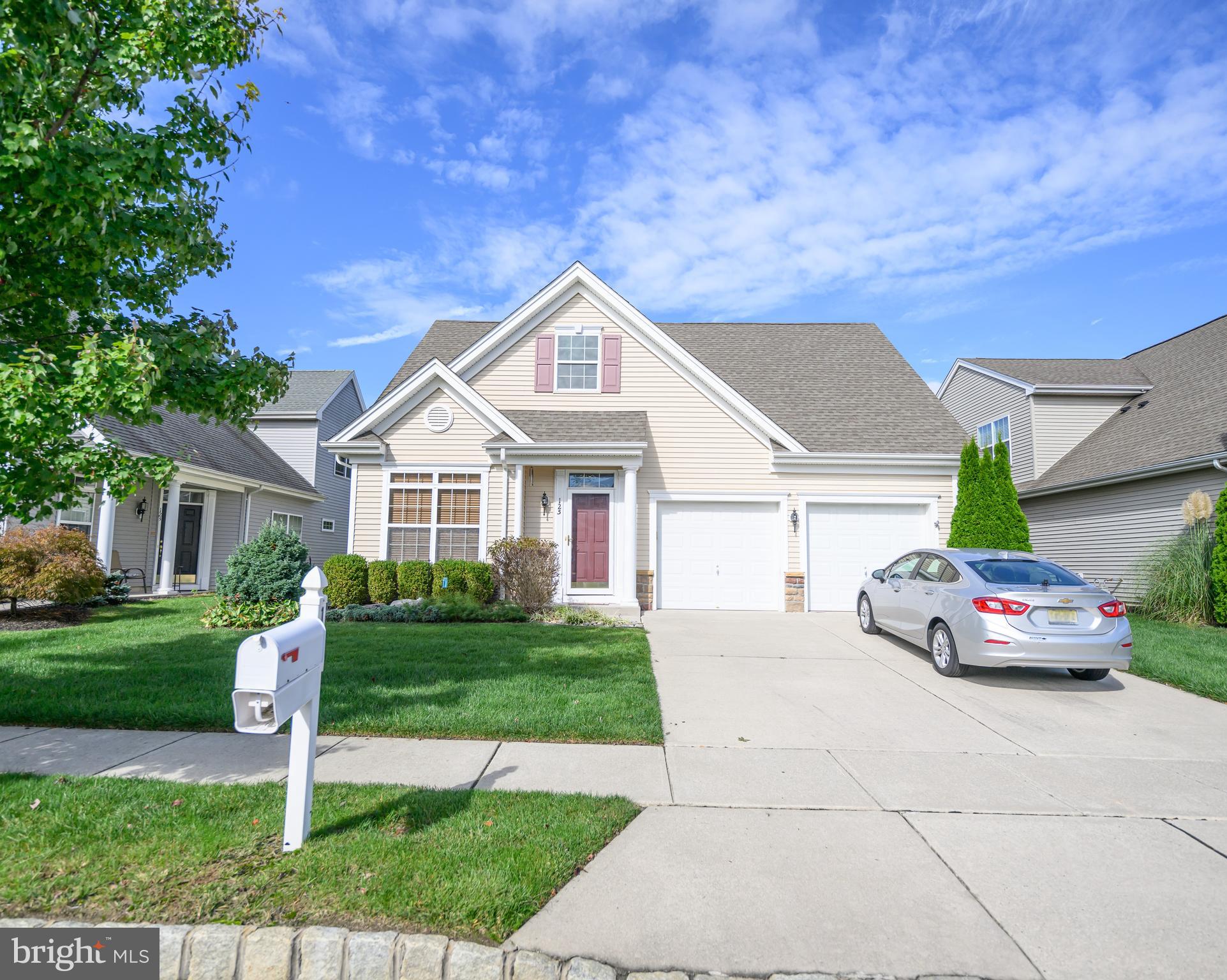 a front view of a house with a yard