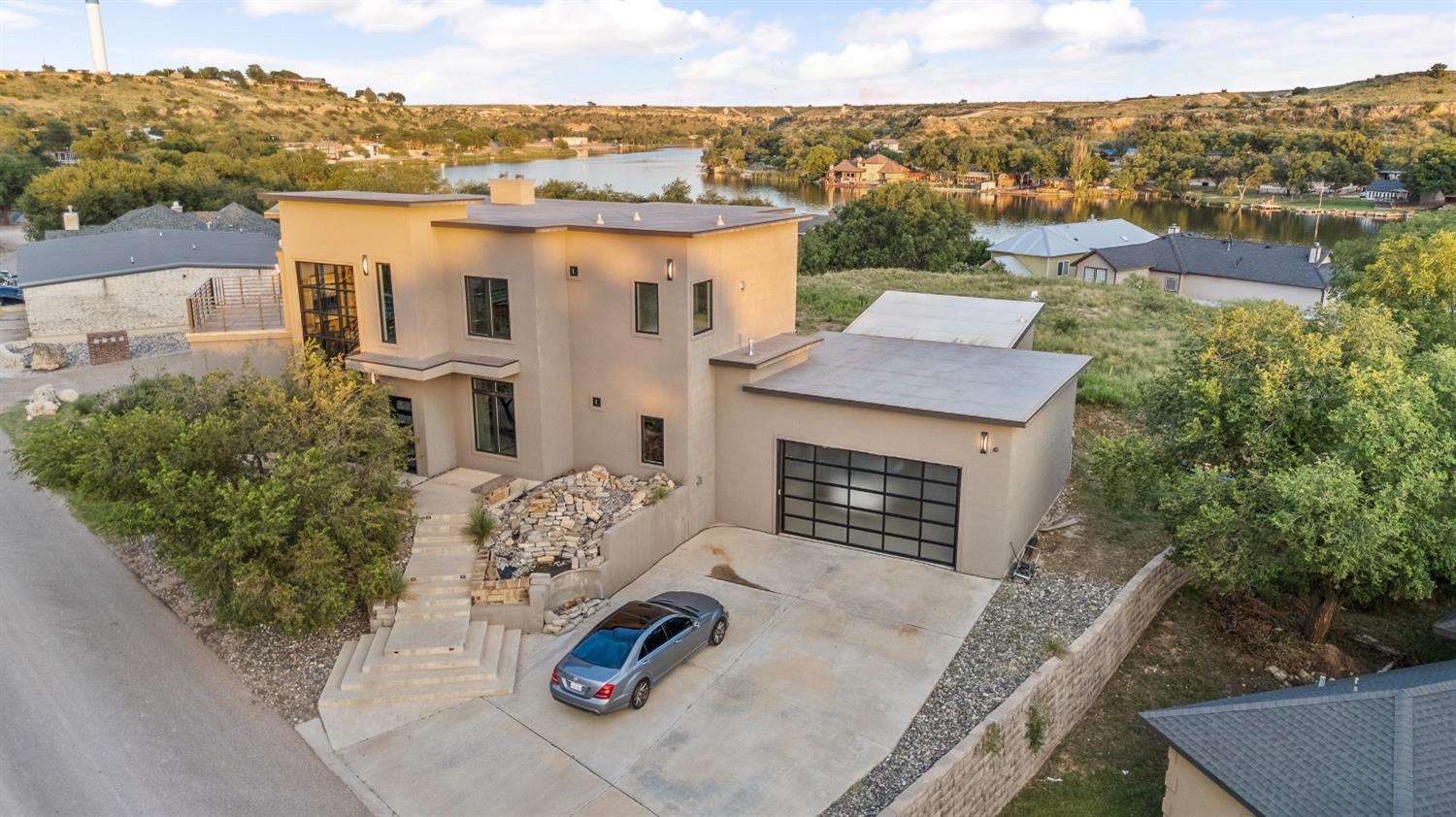 an aerial view of a house with yard