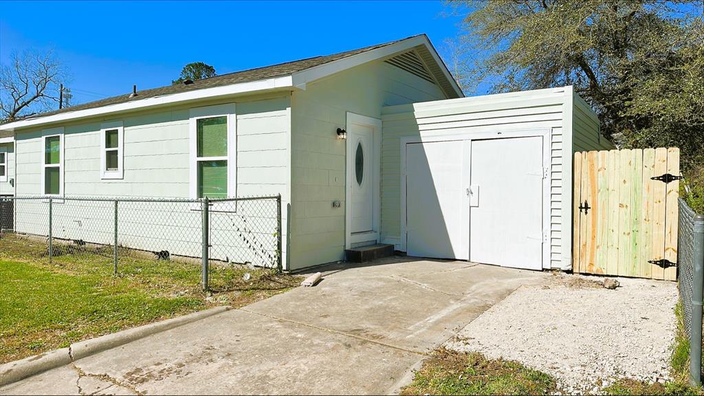 a backyard of a house with wooden fence