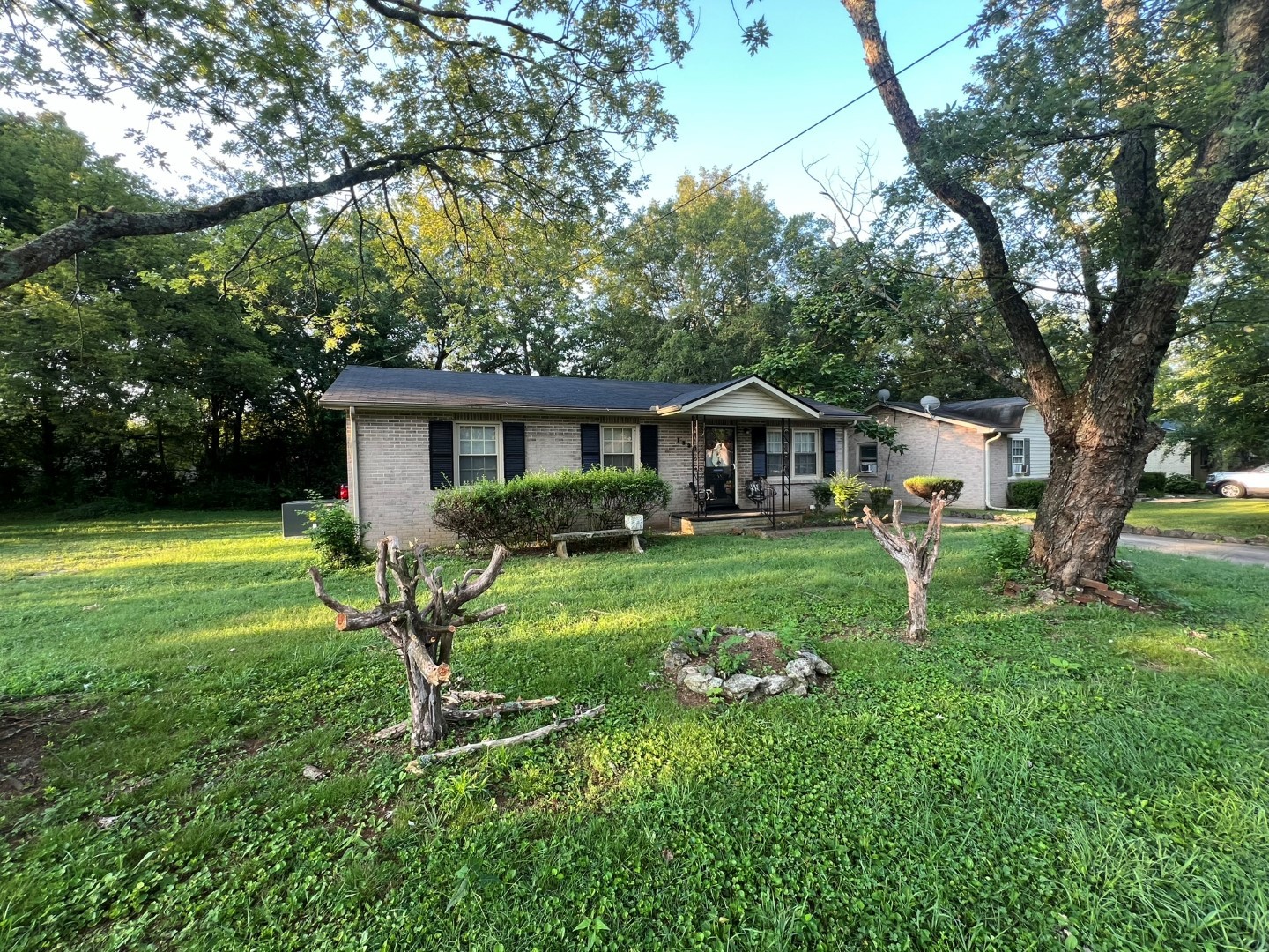 a view of a house with a yard and a patio